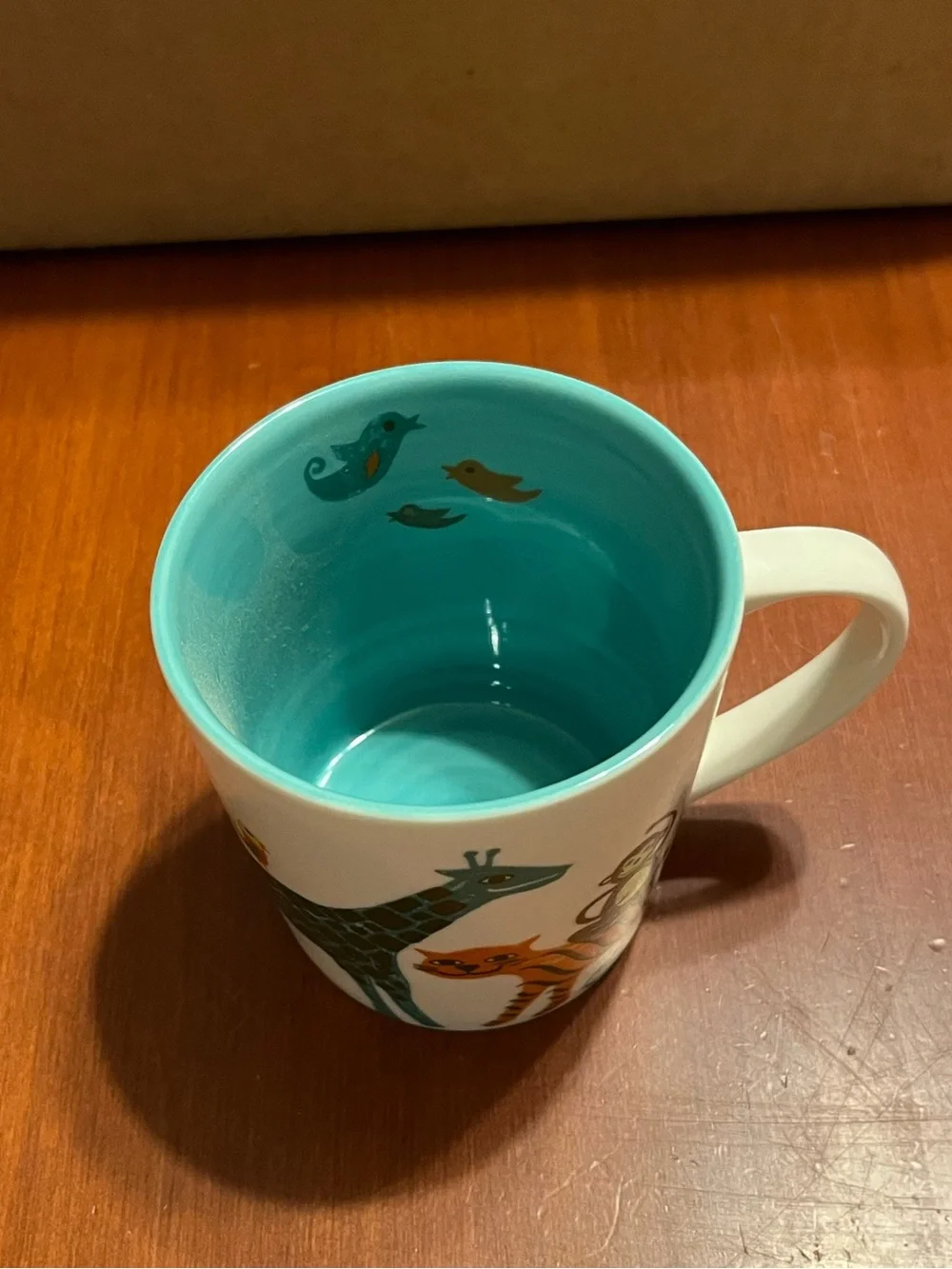 Starbucks White Mug with Teal Interior and Colorful Animal Illustrations